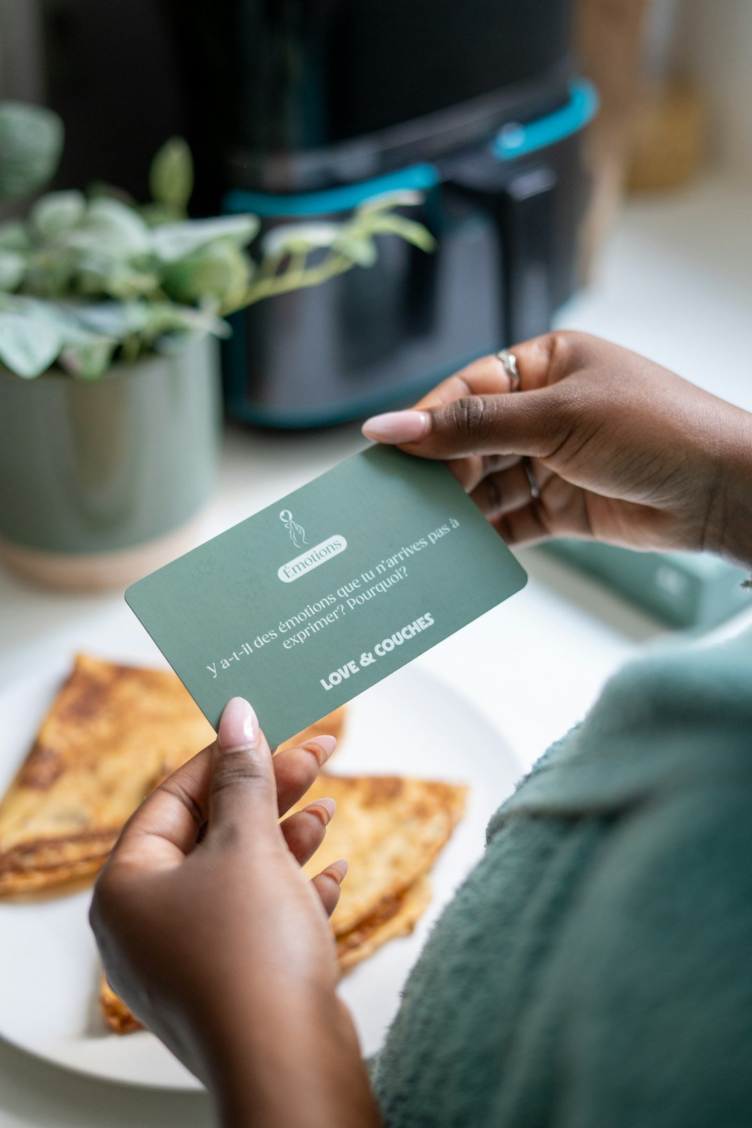 Home someone-is-holding-a-card-next-to-some-crepes-bk6vqi9lsxw
